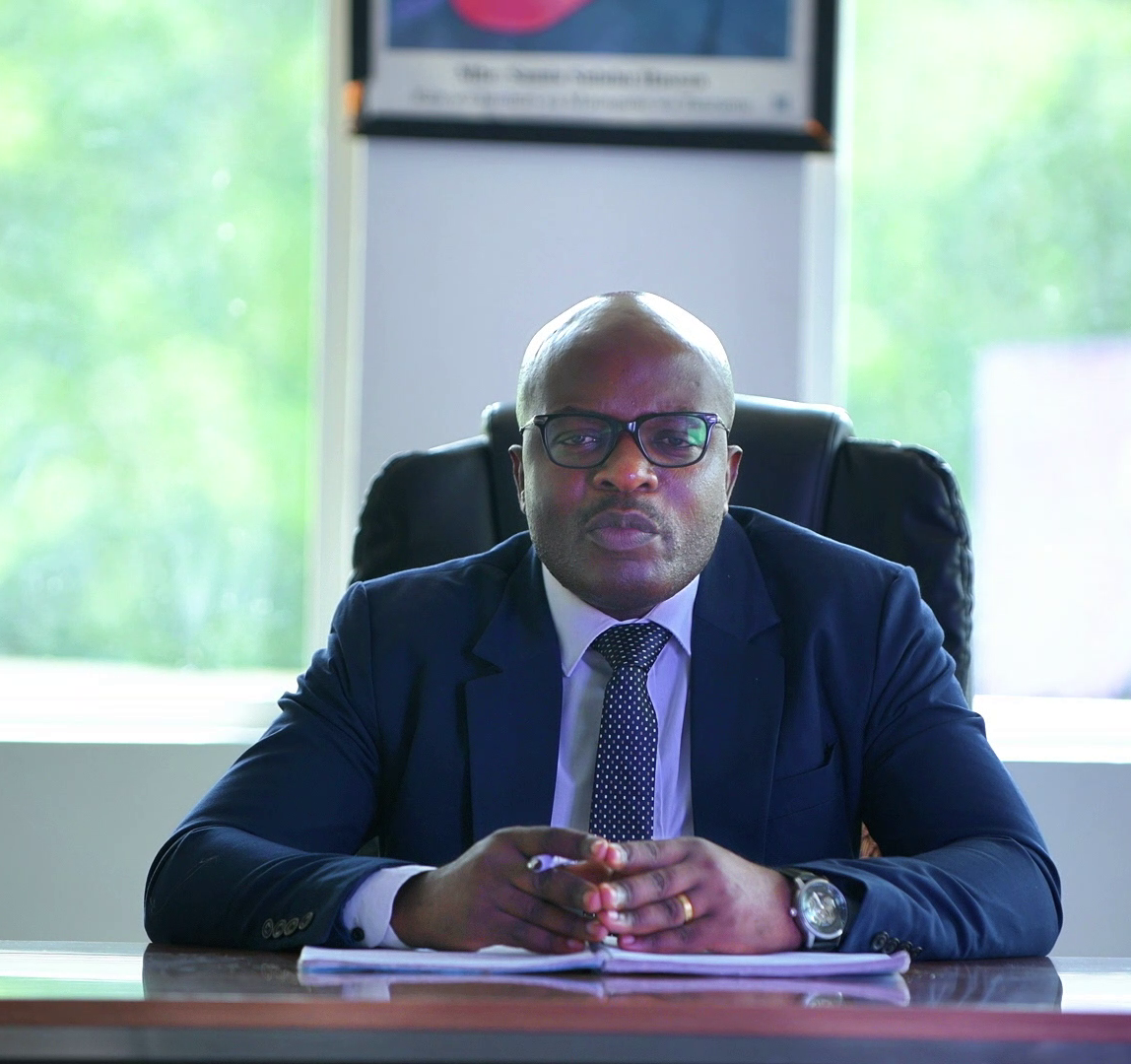 DR. Charles Mwansasu